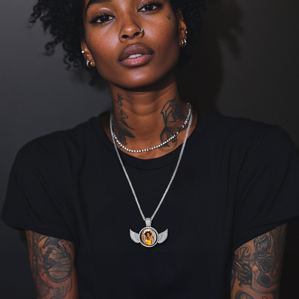 Woman wearing angel wing photo necklace