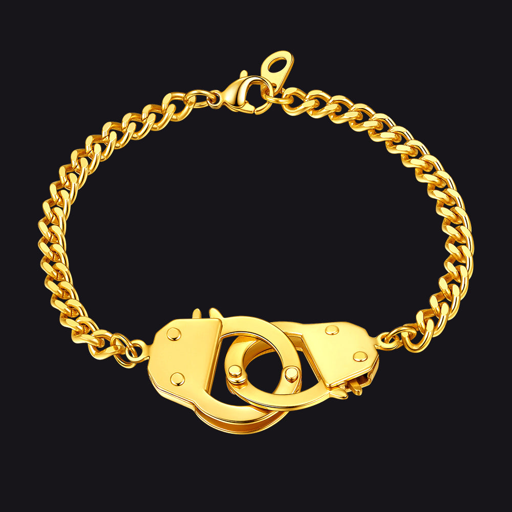 Gold chain bracelet with handcuff clasp on a black background