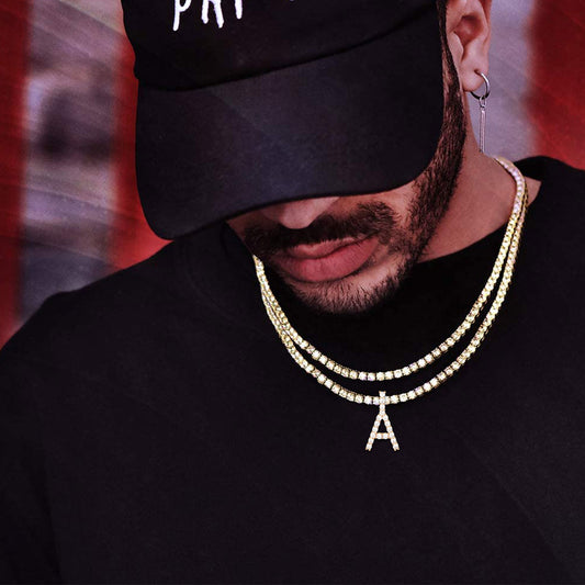 Male model styling bold initial pendant necklace over black A-shirtimg