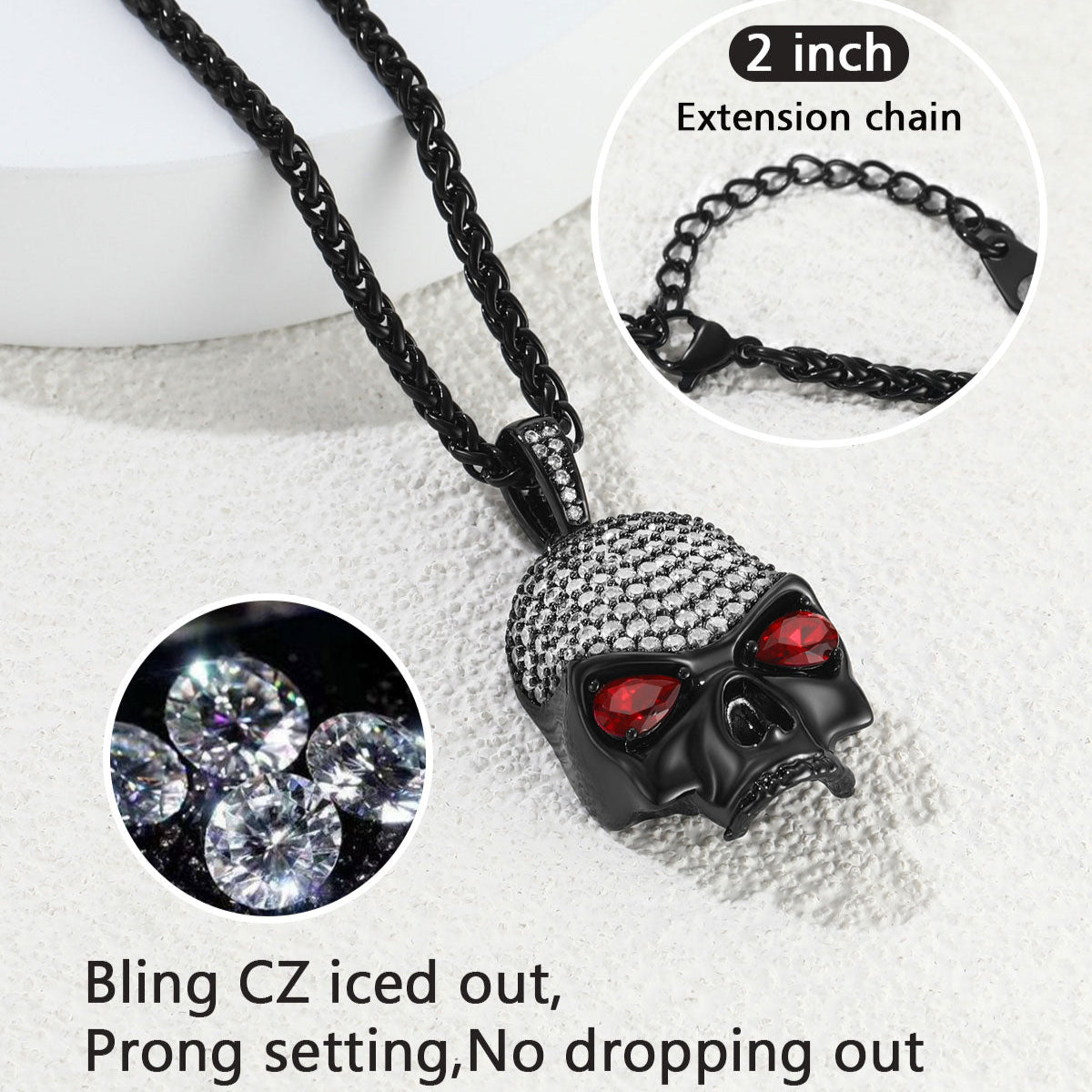 Black skull pendant necklace with clear stones on a white background