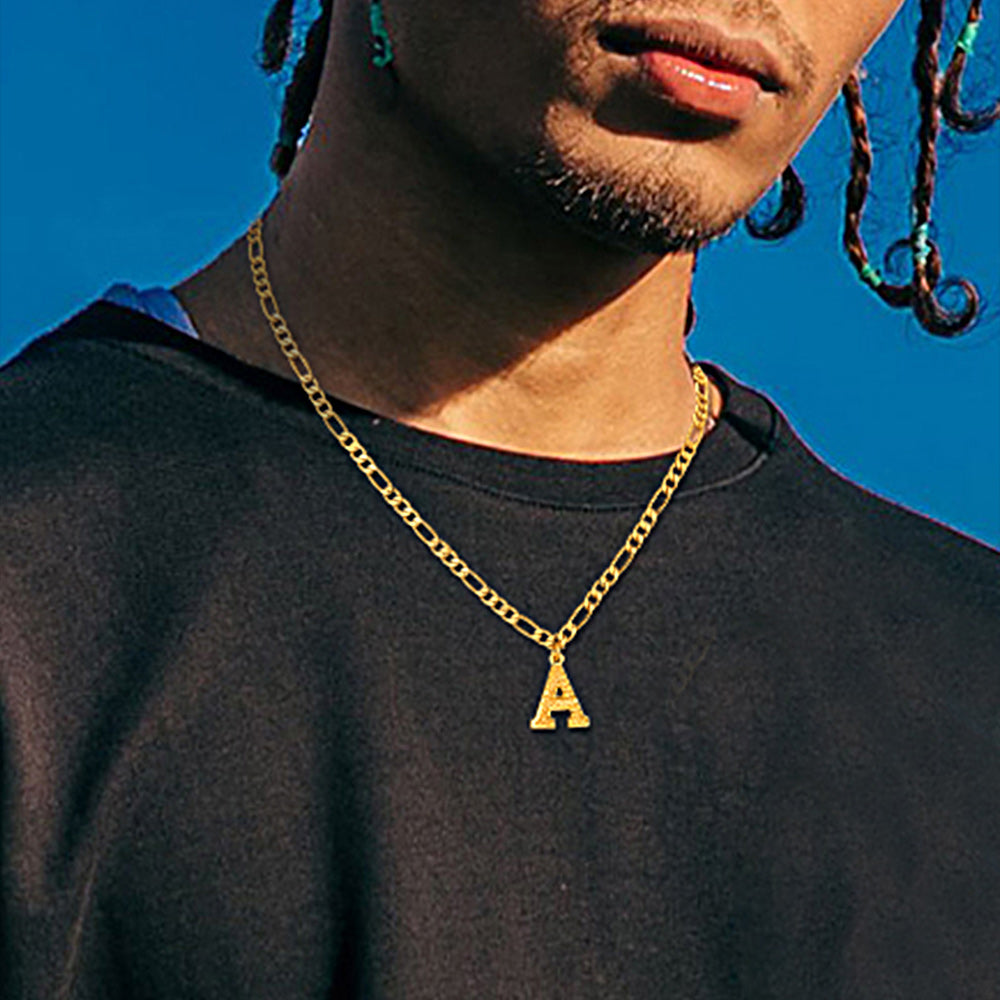Male model wearing letter pendant Figaro chain choker