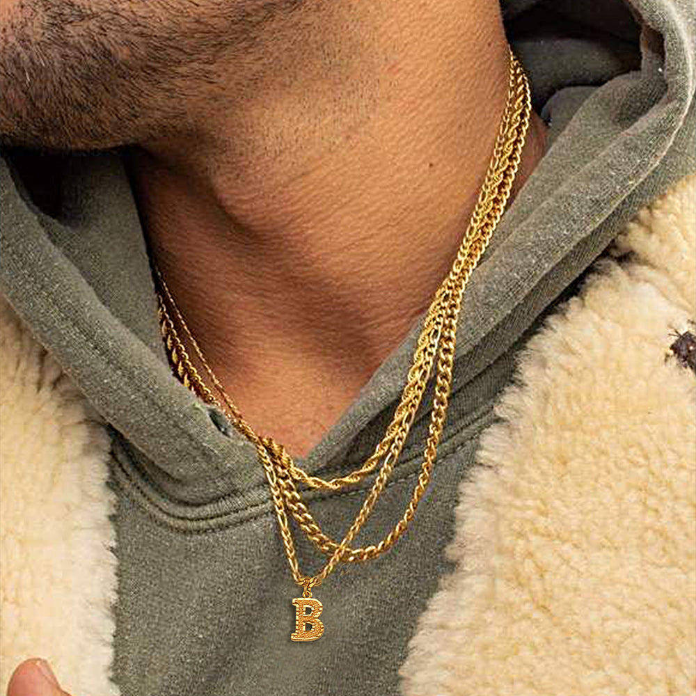 Side view of man showcasing the bold A initial pendant choker