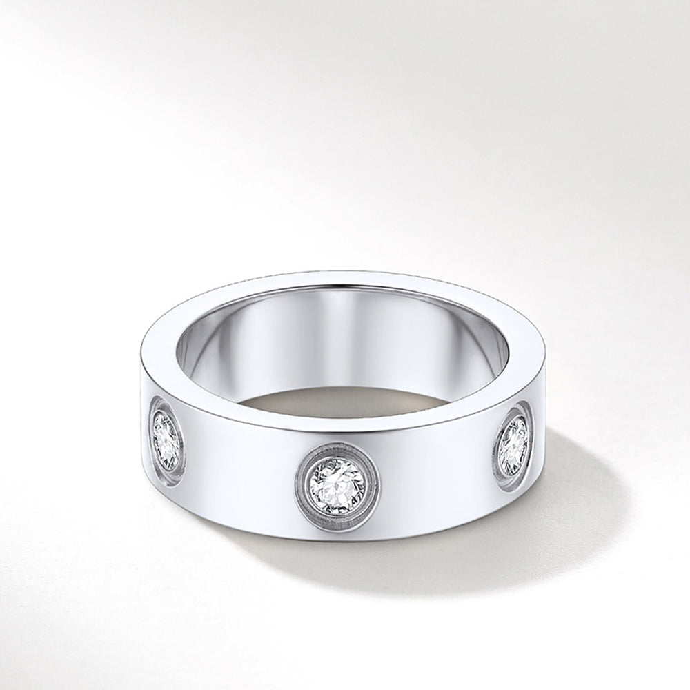 Silver ring with embedded diamonds on a white background