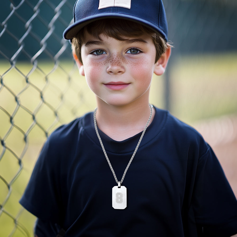 Boy wearing number 8 dog tag pendant necklace
