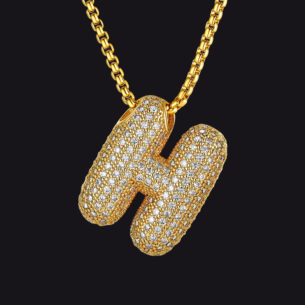 Shimmering H letter pendant in gold with crystal