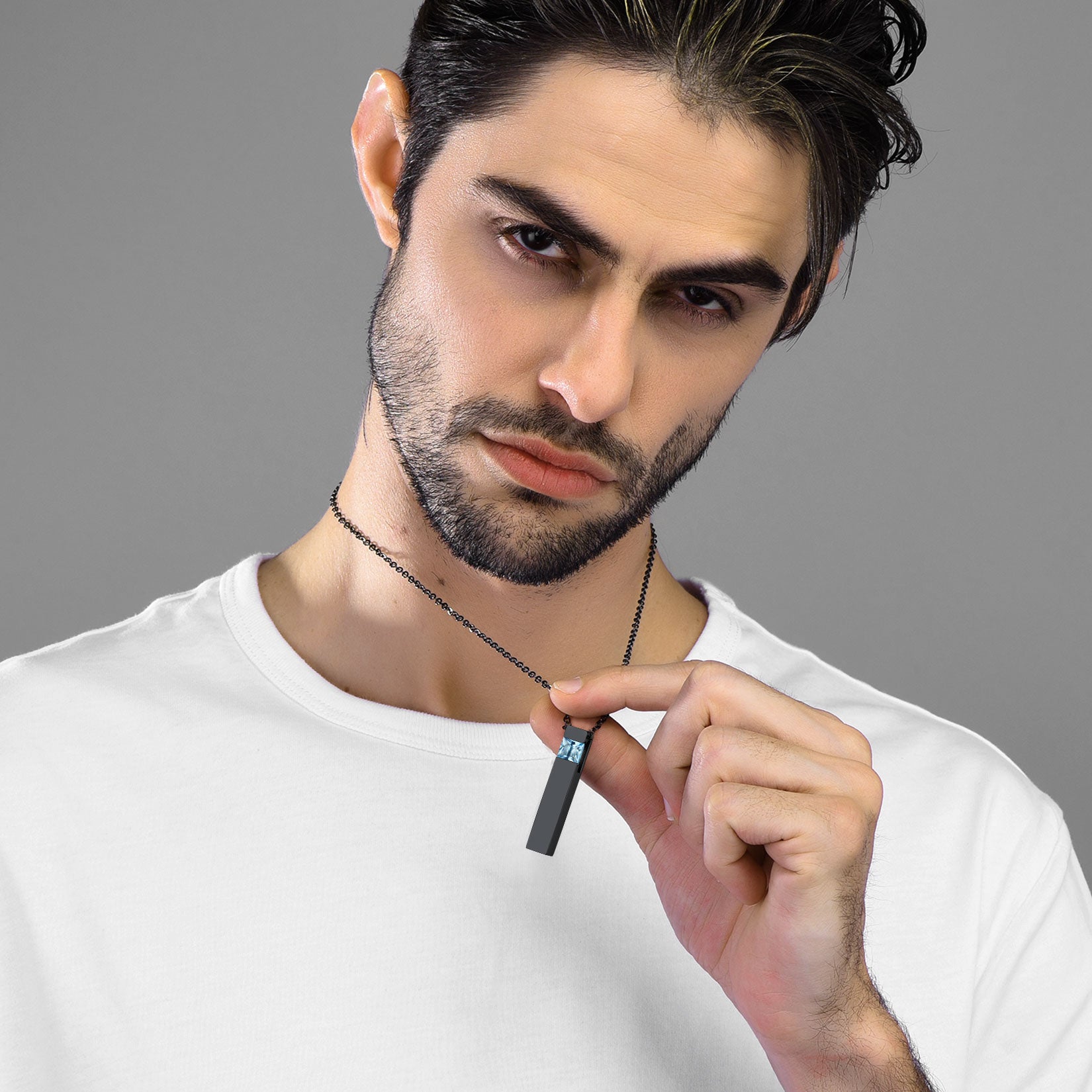 Man wearing a black urn pendant necklace