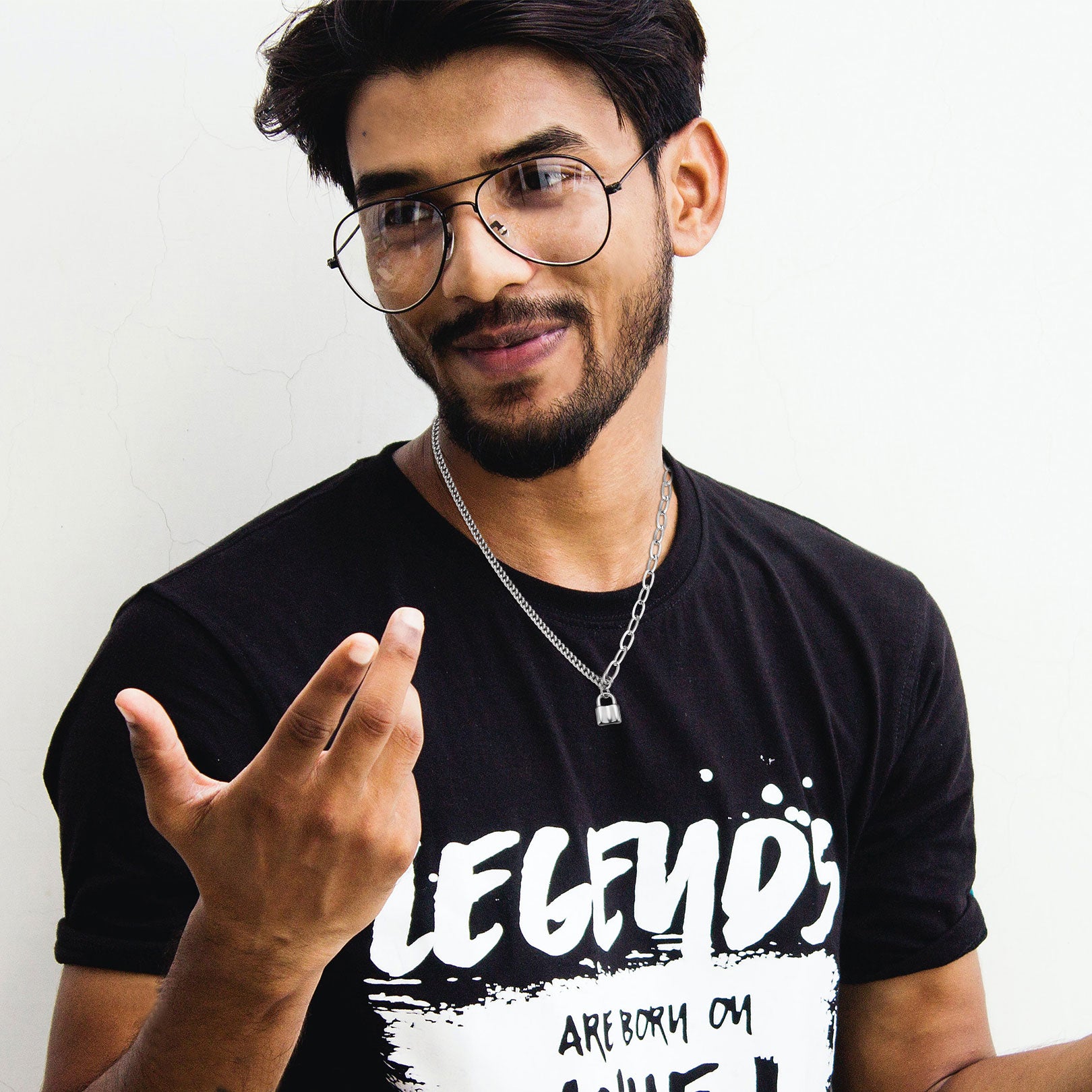 Close-Up of Gold Lock Pendant on Neck