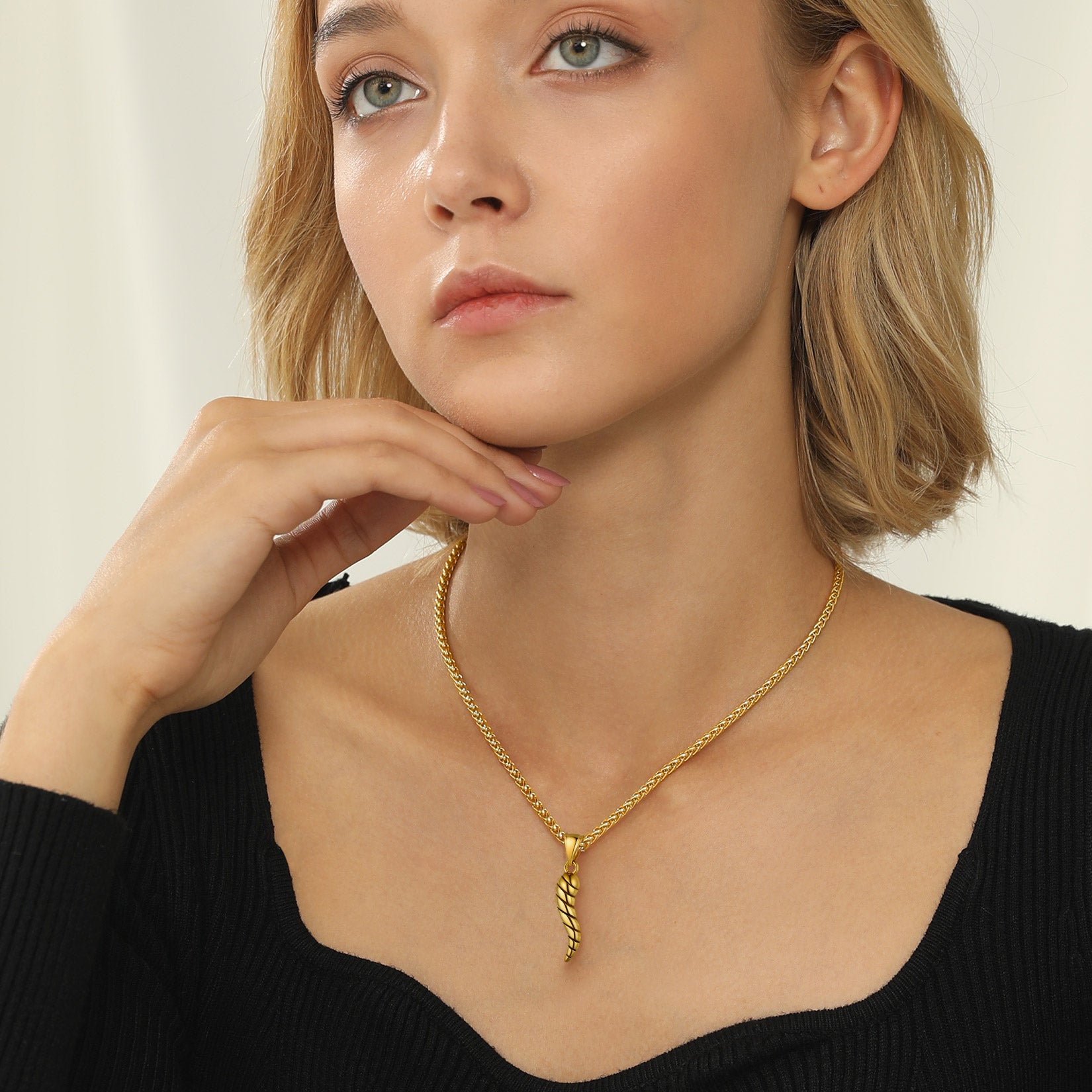 Gold Italian Horn Pendant Necklace on a woman