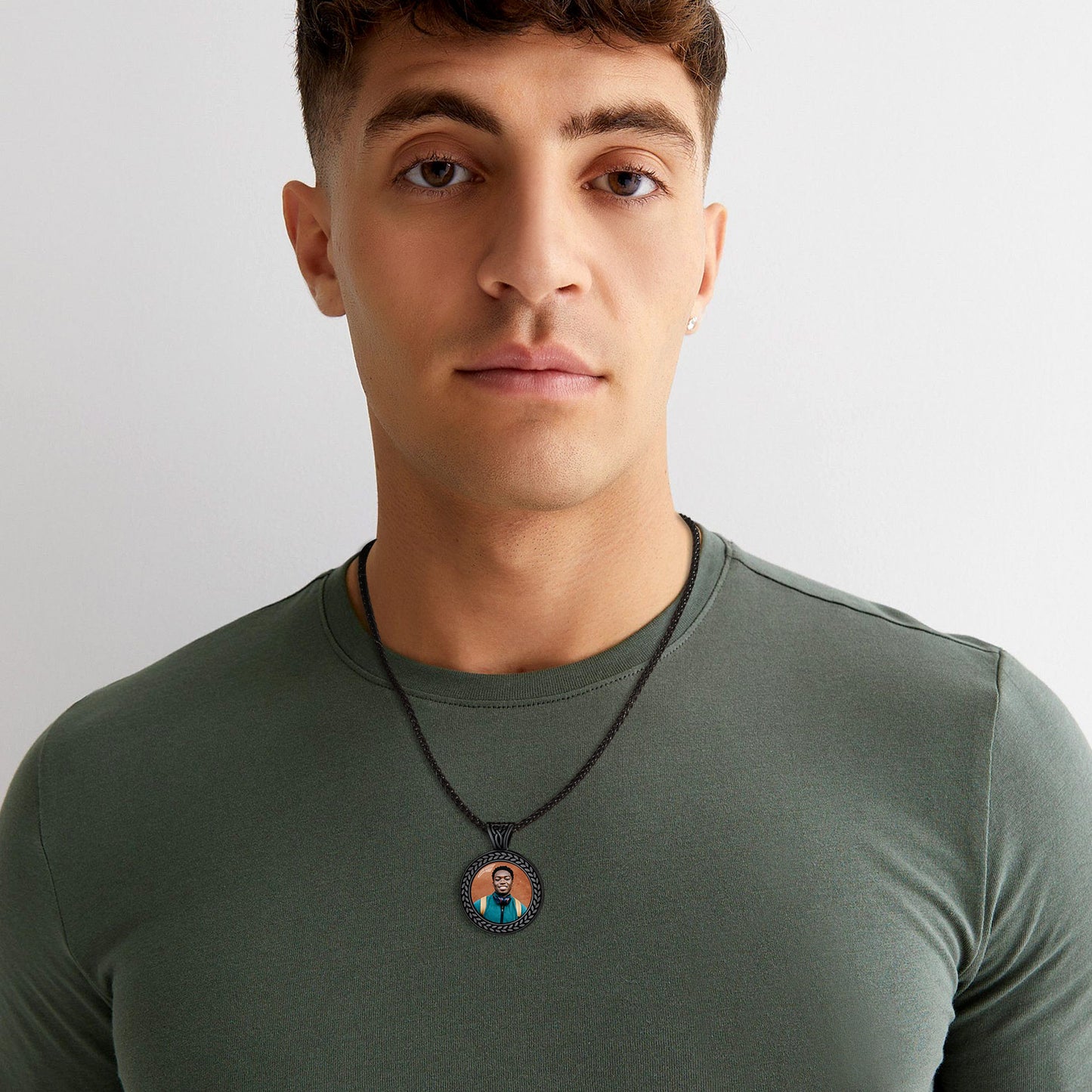 Personalized photo pendant necklace on olive green shirt