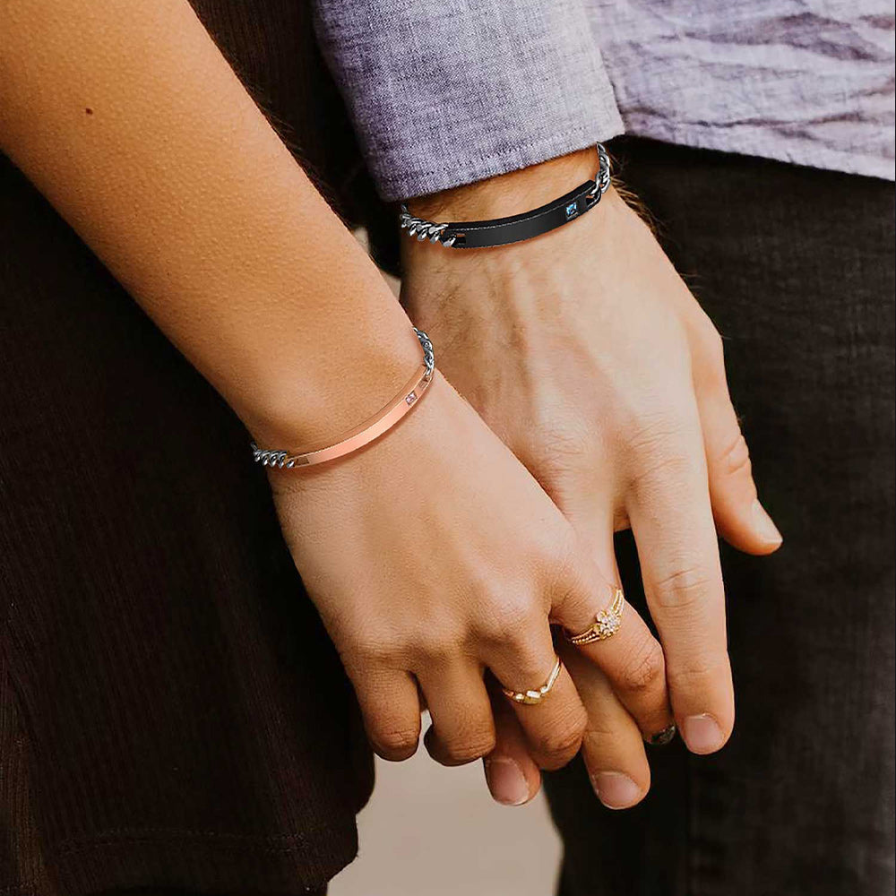 Matching Name ID Bracelets Worn by Couple Holding Hands