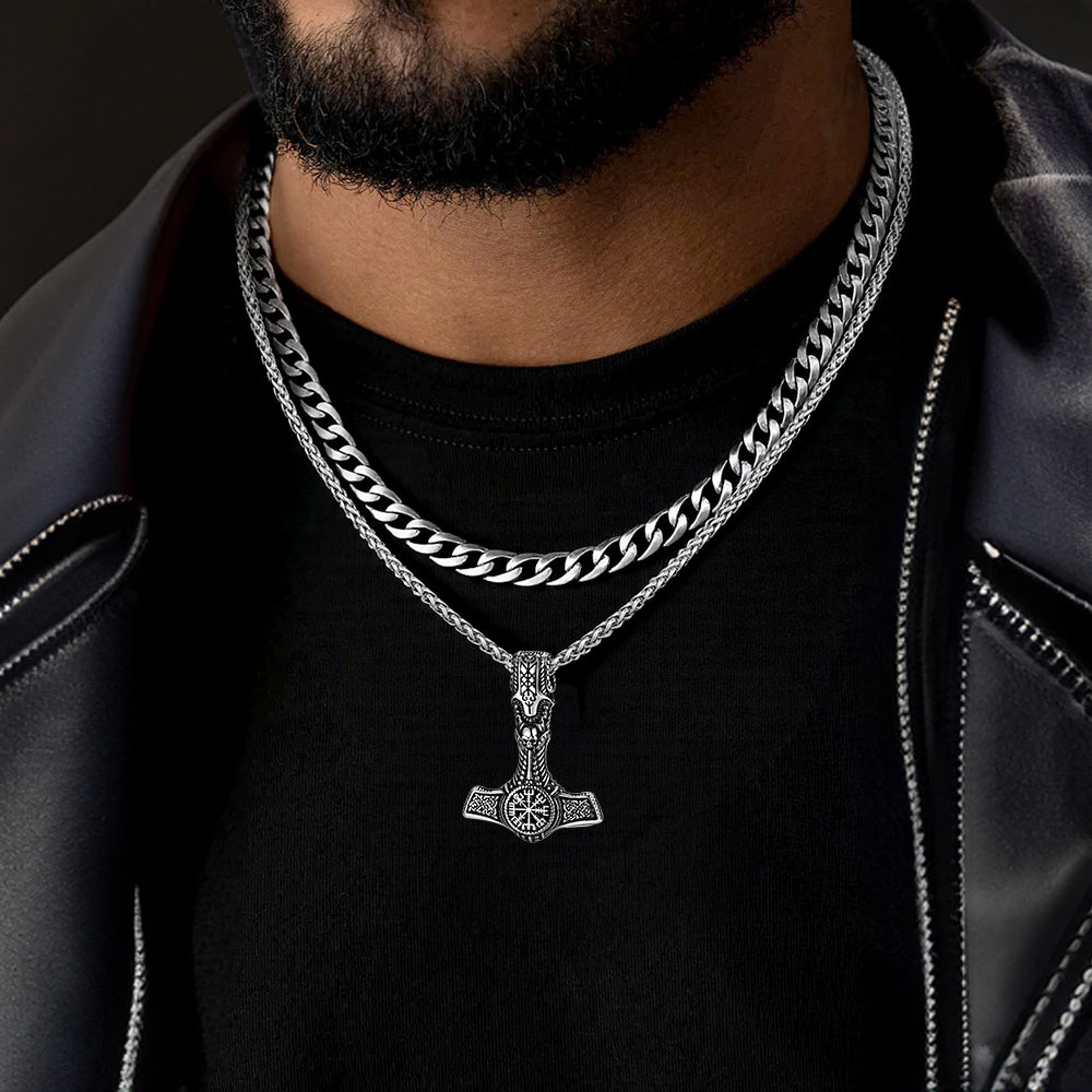 Model pairing Cuban chain and Thor’s hammer necklace set with streetwear outfit.