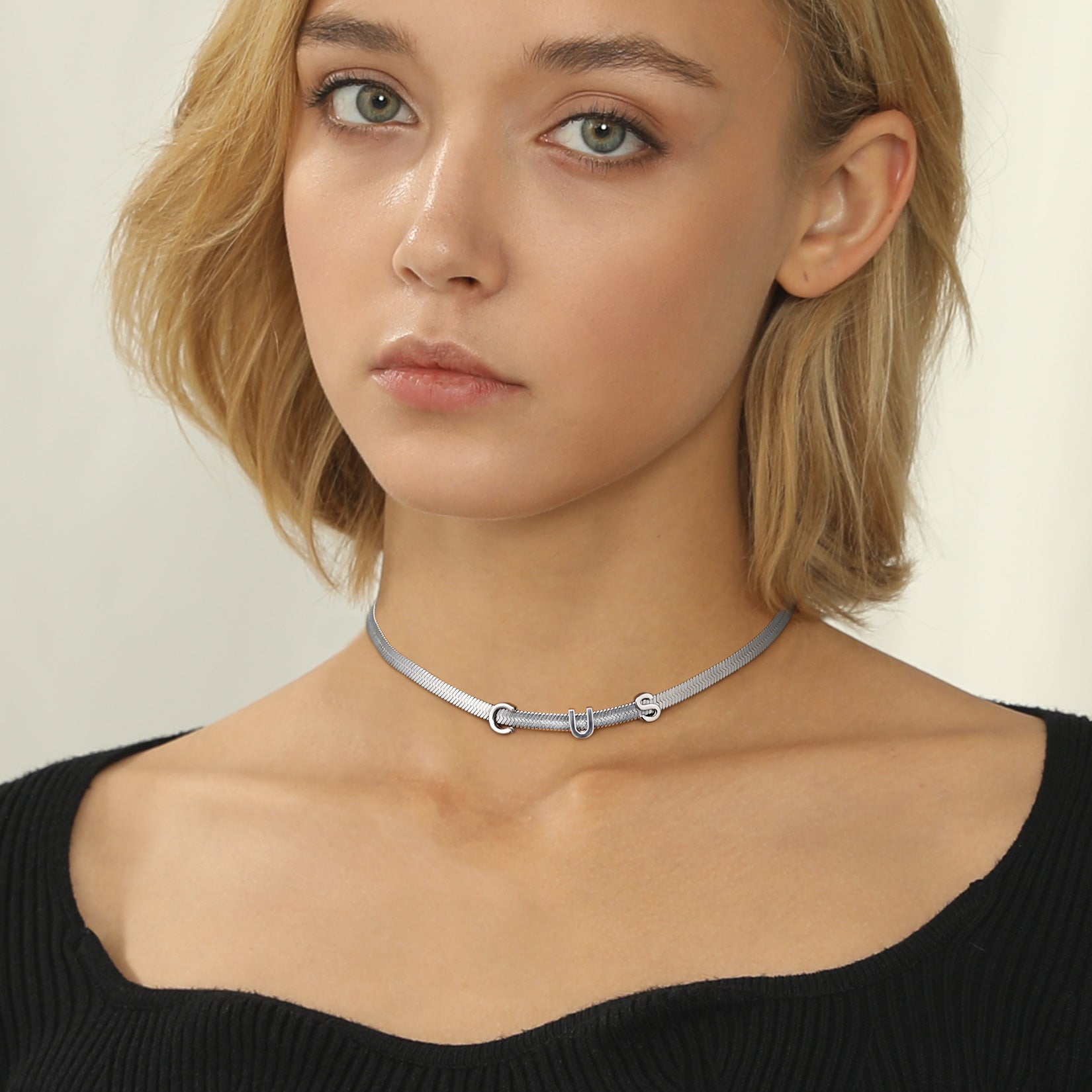 Model wearing personalized name chain necklace in steel