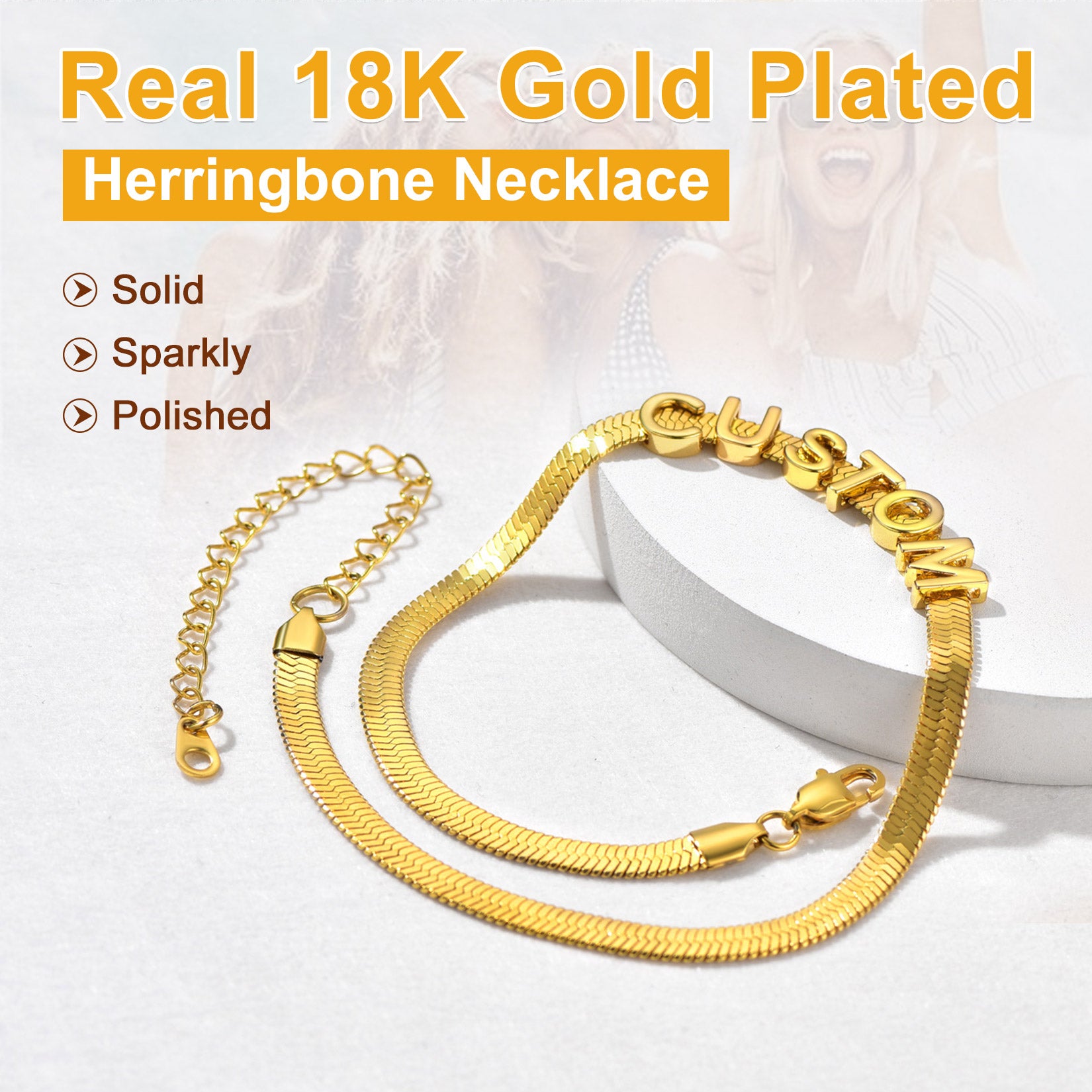 Gold herringbone necklace with 'Real 18K Gold Plated' text on a white background