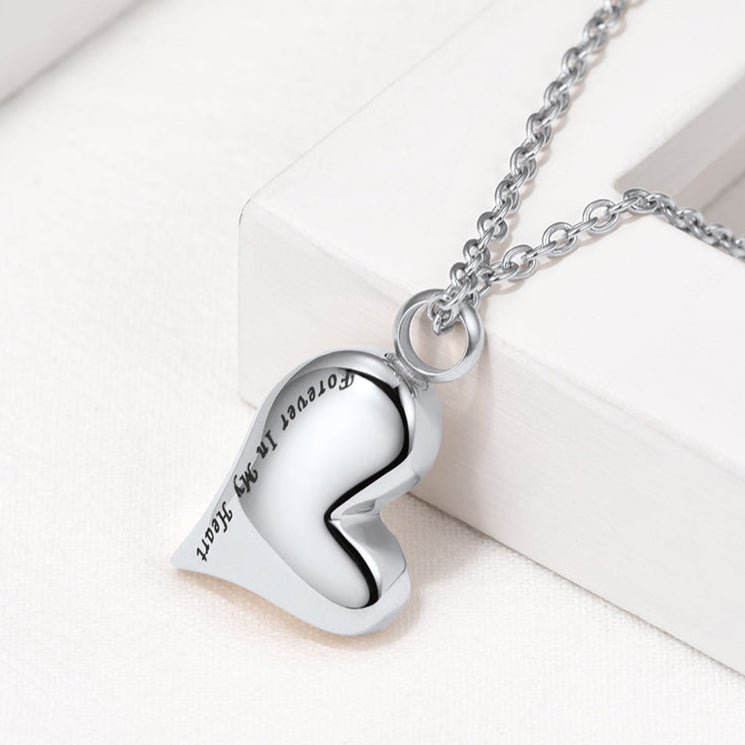 Close-up of engraved “Forever in My Heart” on polished heart urn pendant
