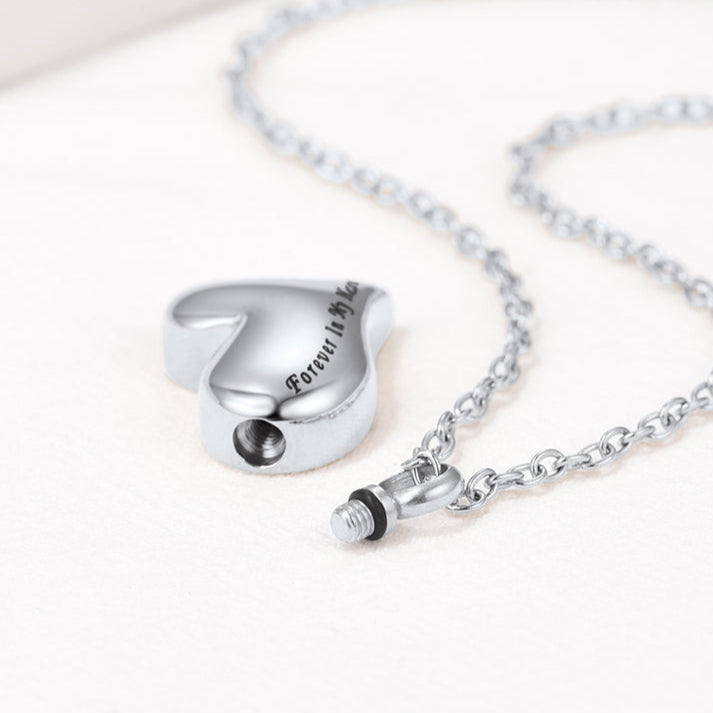 Threaded screw opening detail on heart cremation necklace for secure sealing
