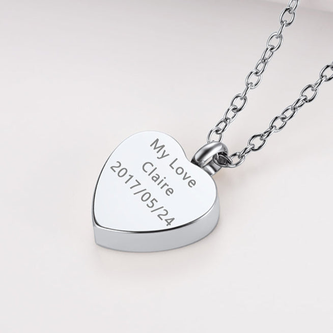 Engraved back view of steel heart urn necklace for ashes and photo