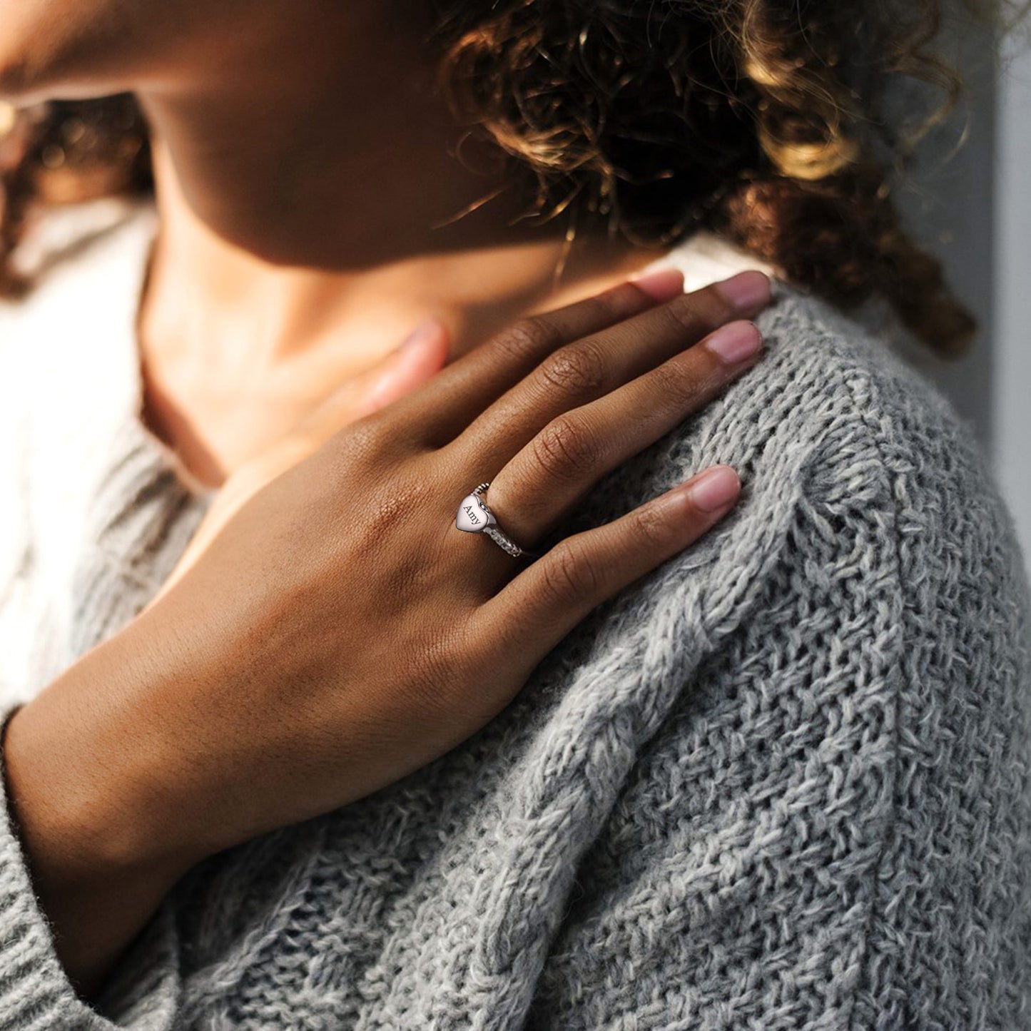 Woman Wearing Steel Ashes Ring with Tearful Smile
