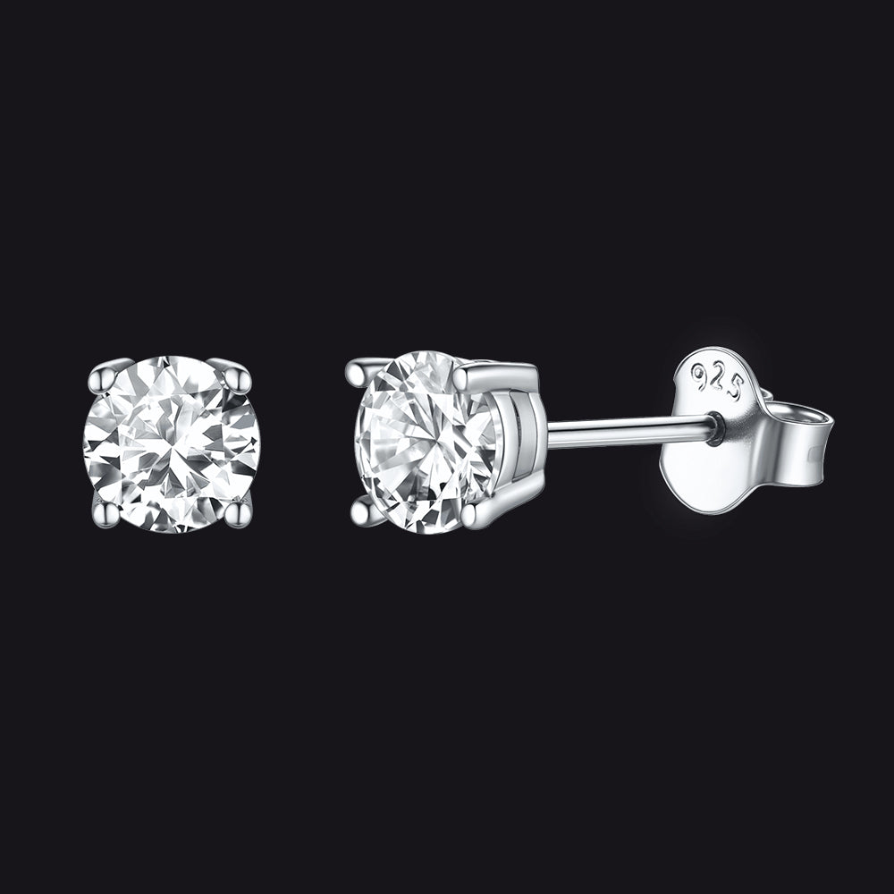 Pair of diamond stud earrings on a black background