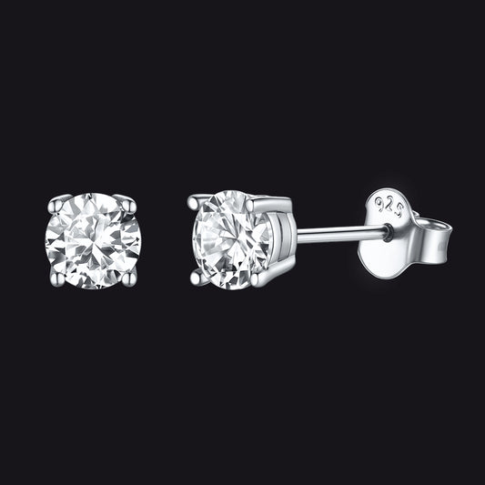 Pair of diamond stud earrings on a black backgroundimg