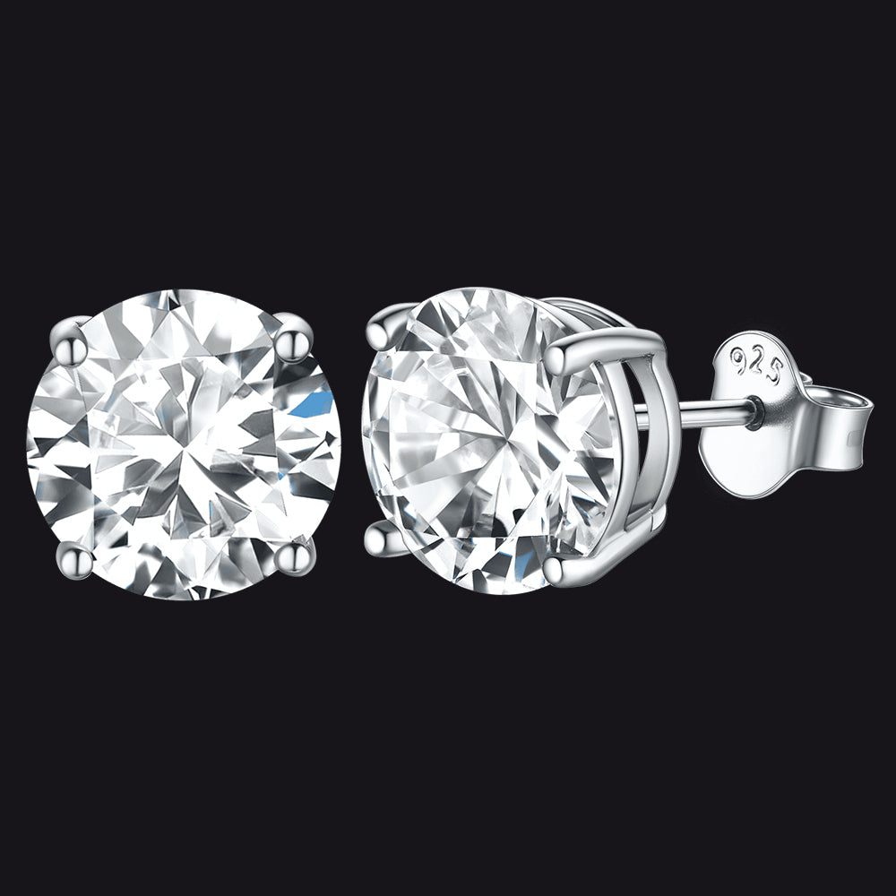 Pair of 9mm diamond stud earrings on a black background