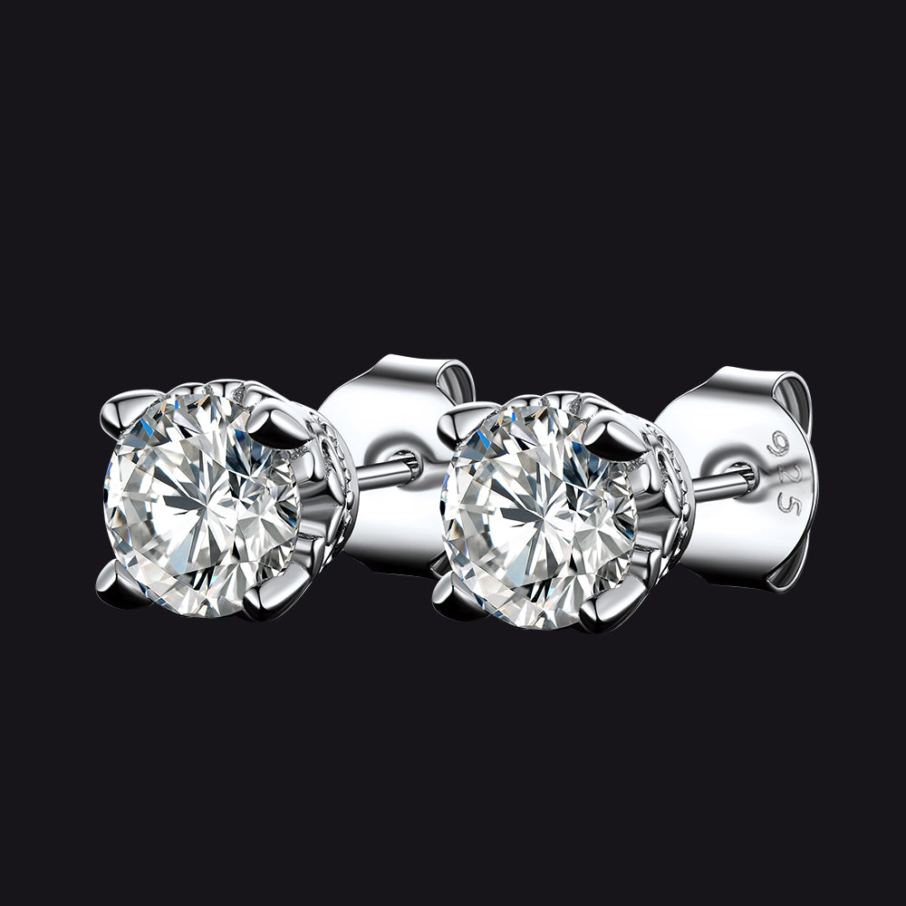 Sterling Silver Pair of diamond stud earrings on a black background