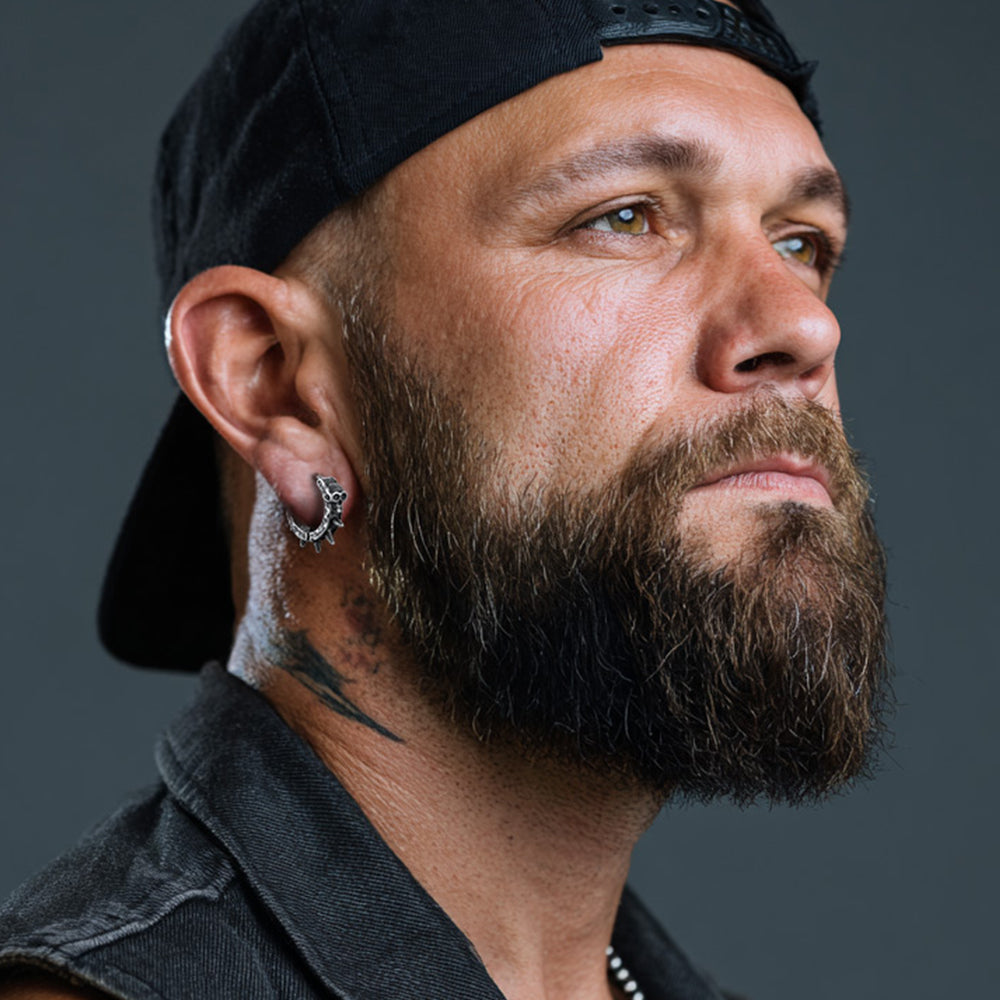 Men wearing Gothic Vintage Black Skull Spiked Hoop Earrings for Men