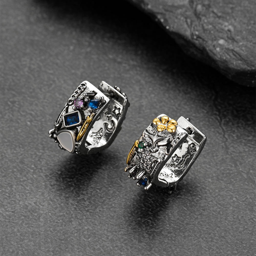 Vintage punk style sterling silver hoop earrings featuring engraved stars and graffiti motifs