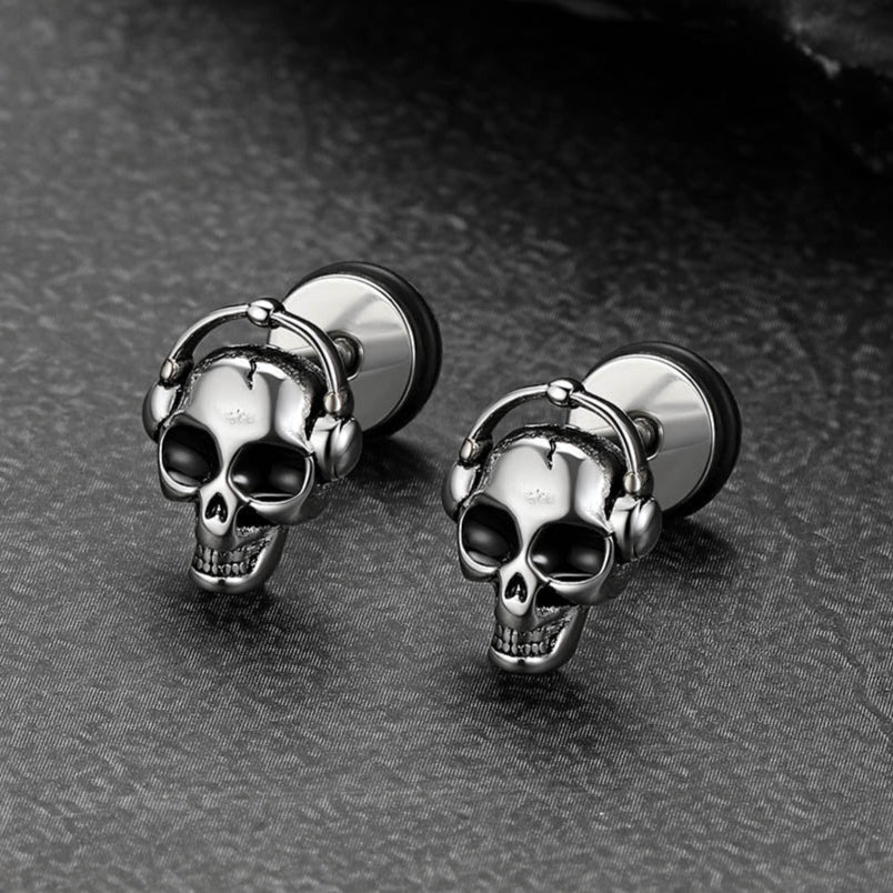Close-up view of stainless steel Gothic skull stud earrings with Halloween punk style