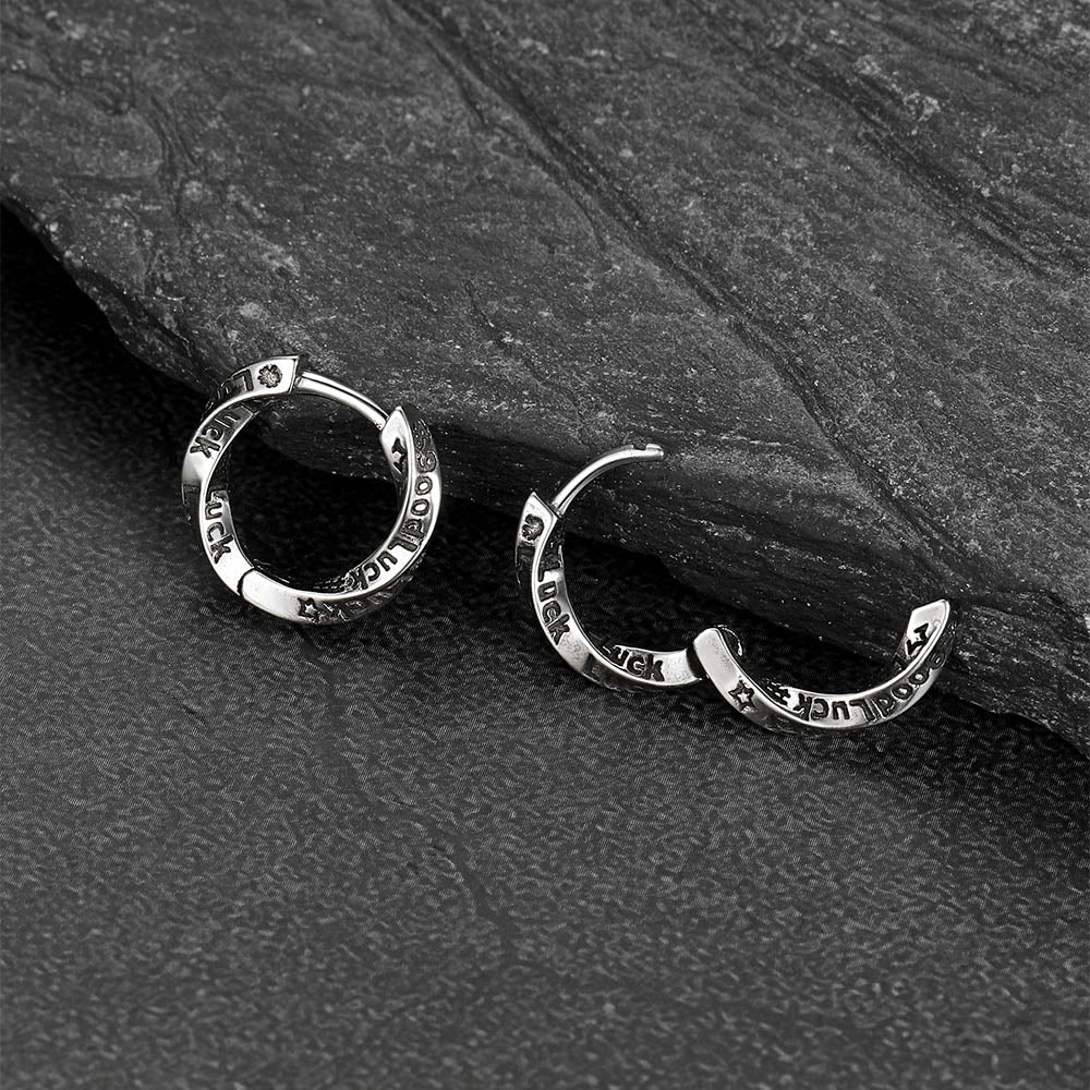 Engraved Luck copper Mobius hoop earrings close-up view