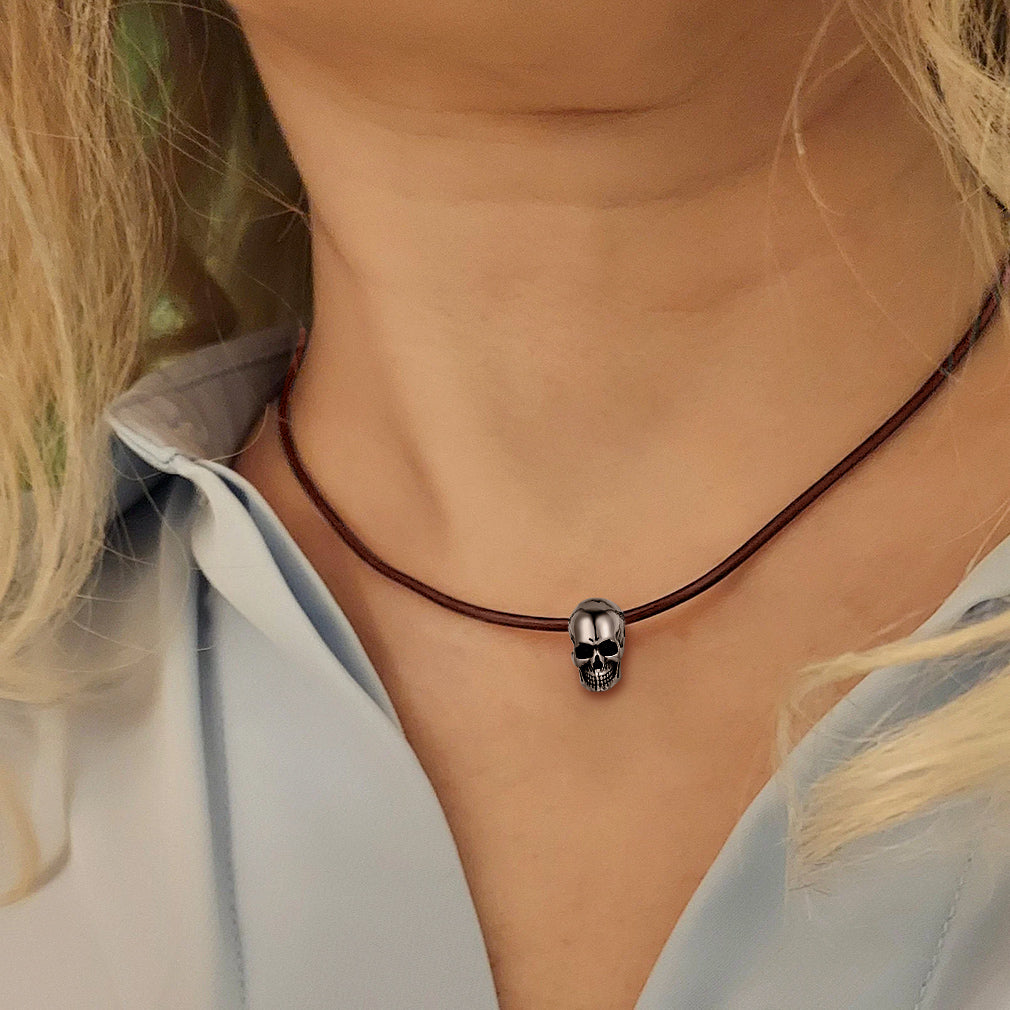 Braided leather cord chain necklace for men with a silver skull pendant, minimalist and stylish.