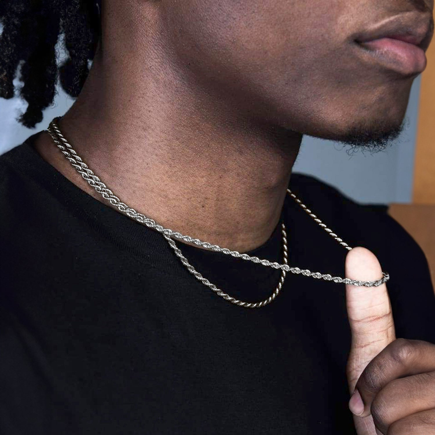 Male model wearing layered 3mm and 6mm twisted rope link chain necklaces