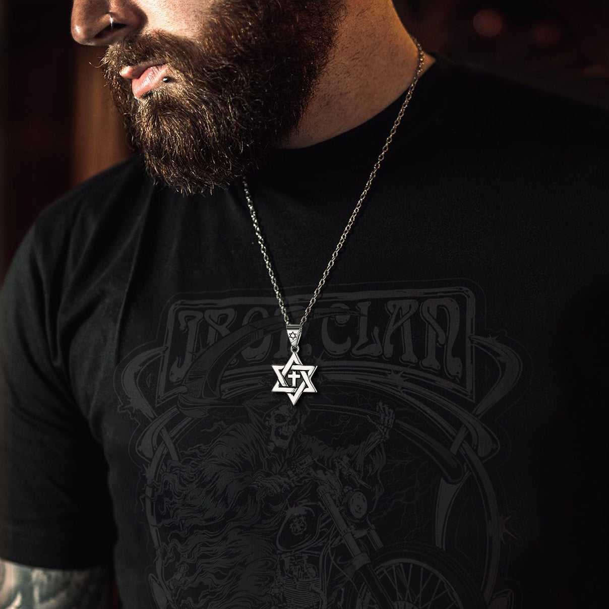 Man wearing Star of David with cross necklace