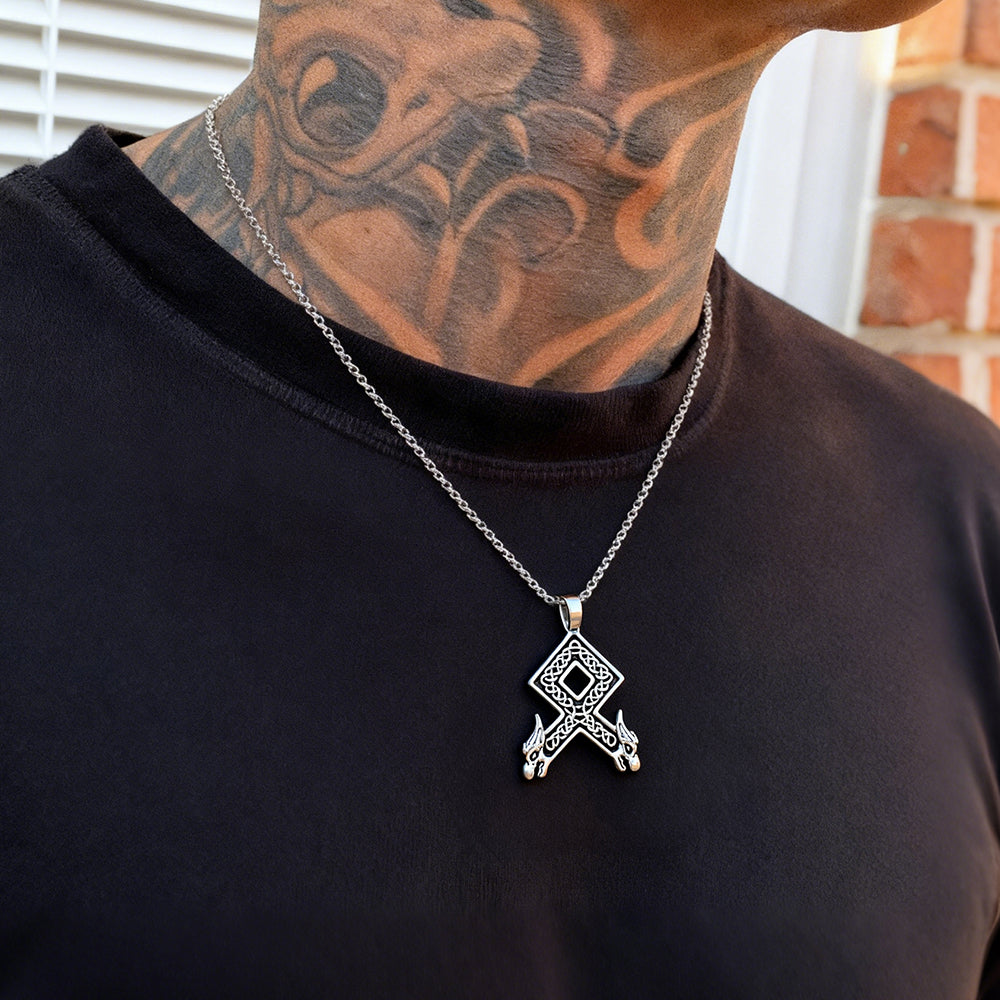 Person wearing a black shirt Othala Rune Wolf Heads Pendant Necklace