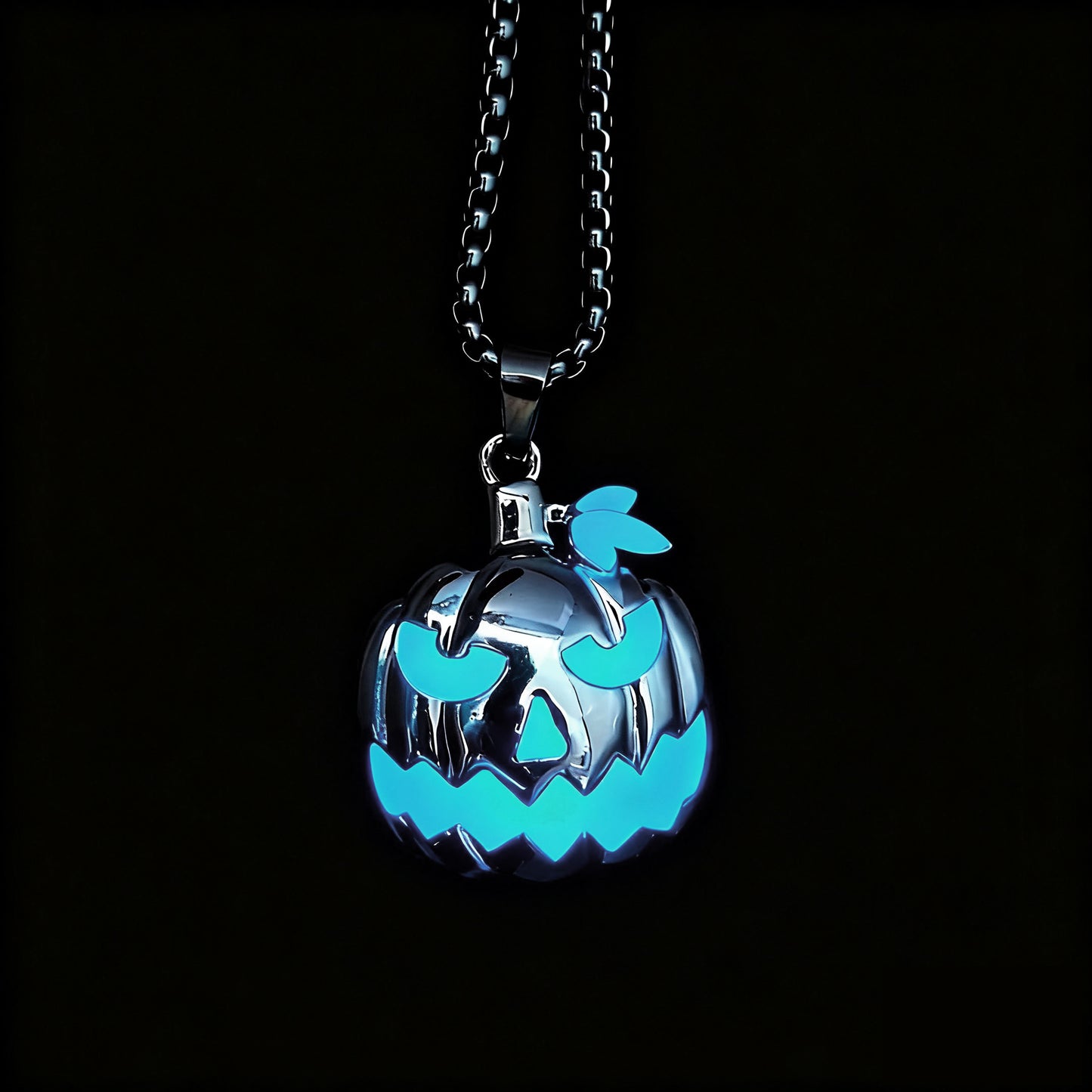 Close-up of glowing skull pumpkin pendant for Halloween accessory