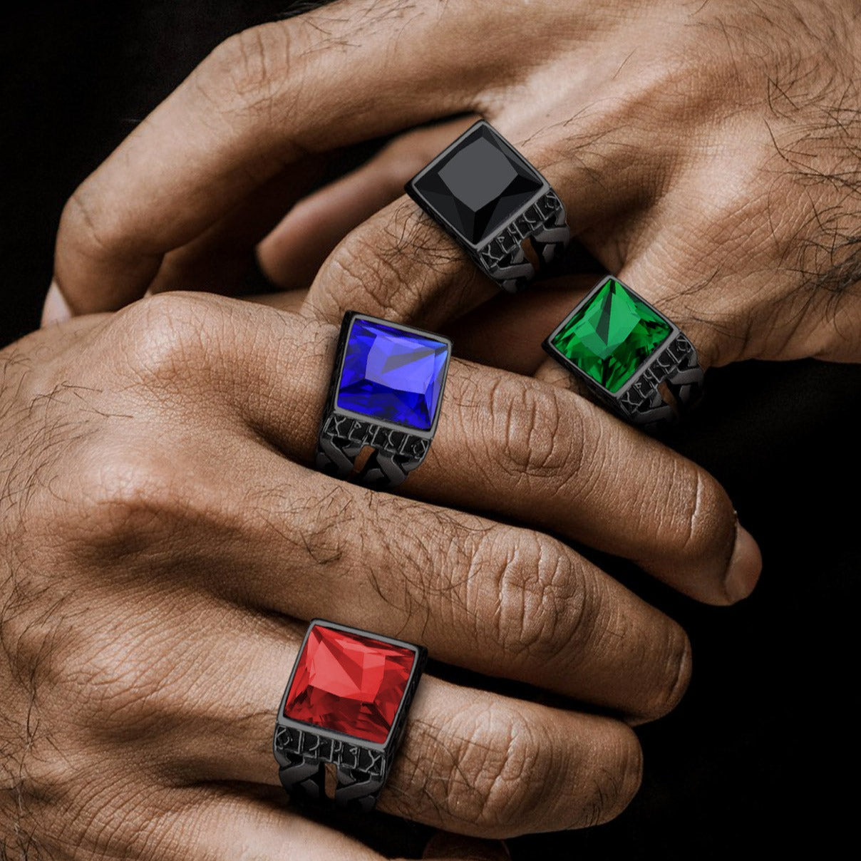 Men's gemstone ring with black onyx, emerald, sapphire and ruby