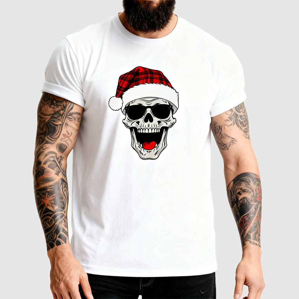 Person wearing a white t-shirt with a skull design wearing a Santa hat on a plain background