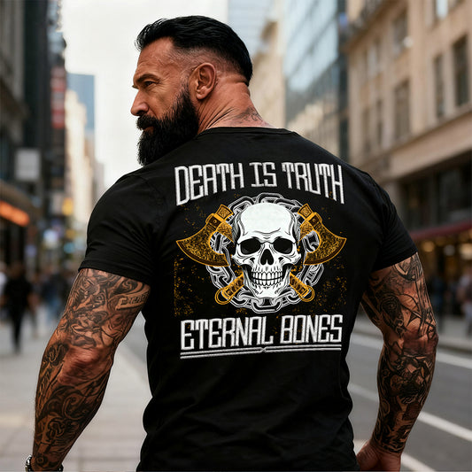 Man wearing a black t-shirt with a skull design and text on the back, standing in an urban setting.
