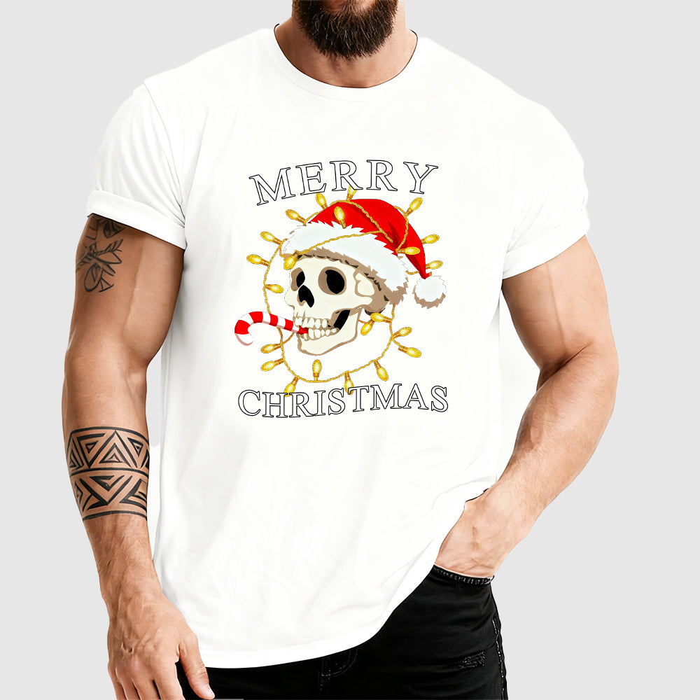 Person wearing a white t-shirt with a Christmas-themed design featuring a skull in a Santa hat.