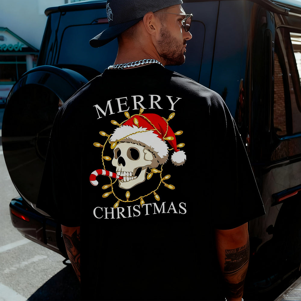 Person wearing a black t-shirt with a Christmas-themed design and text.