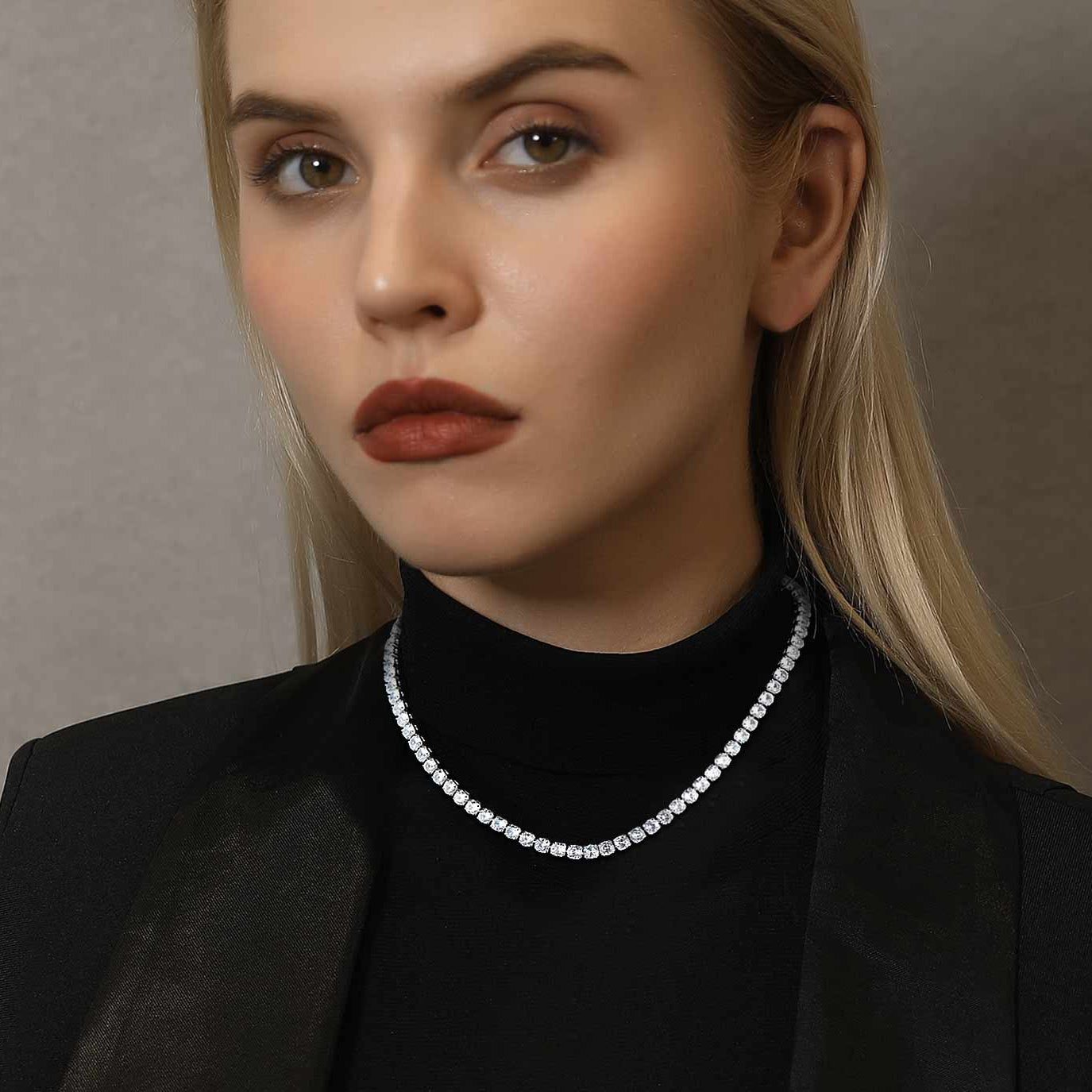 Woman wearing diamond tennis chain necklace