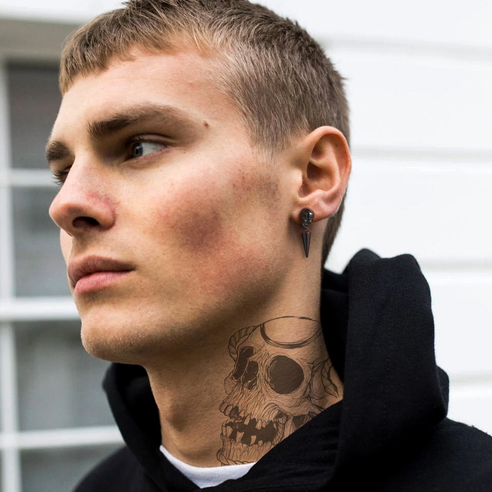 Man wearing Punk Spike Skull Earrings for Men, black earrings