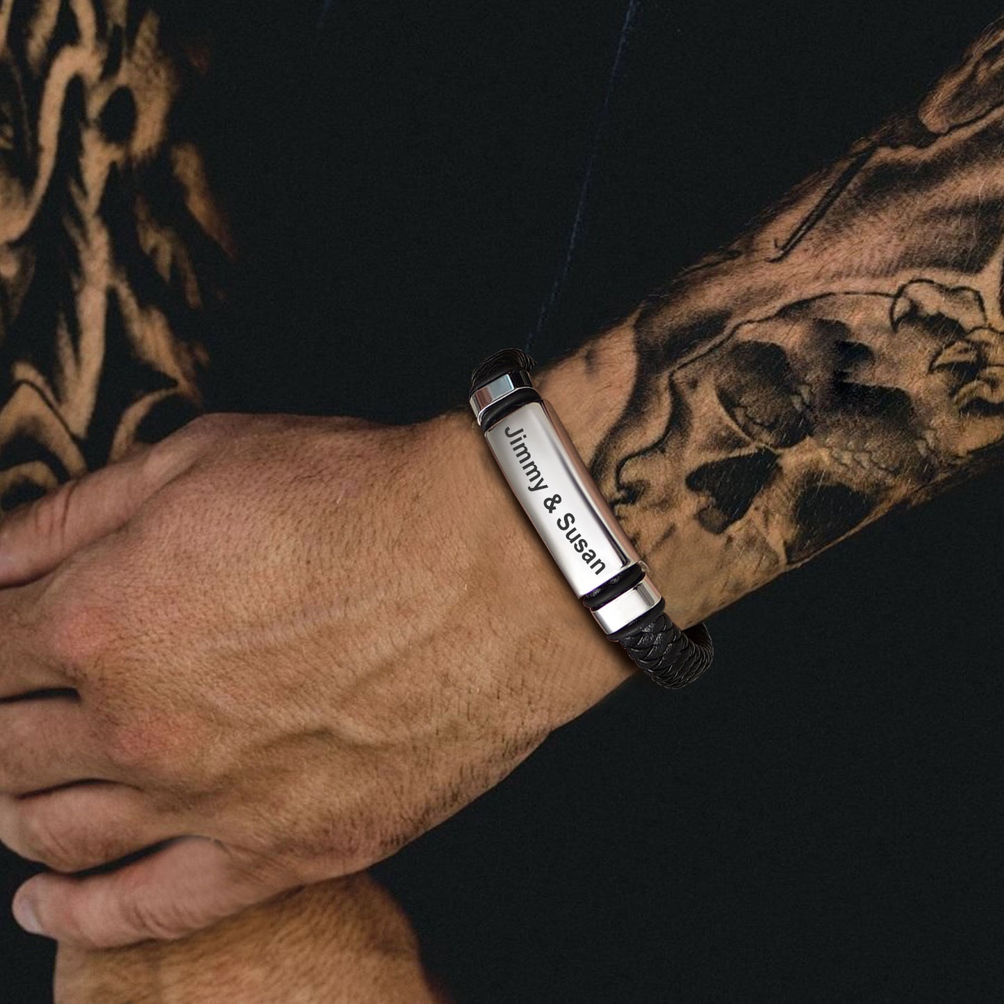 Man wearing custom engraved leather bracelet, Jimmy & Susan