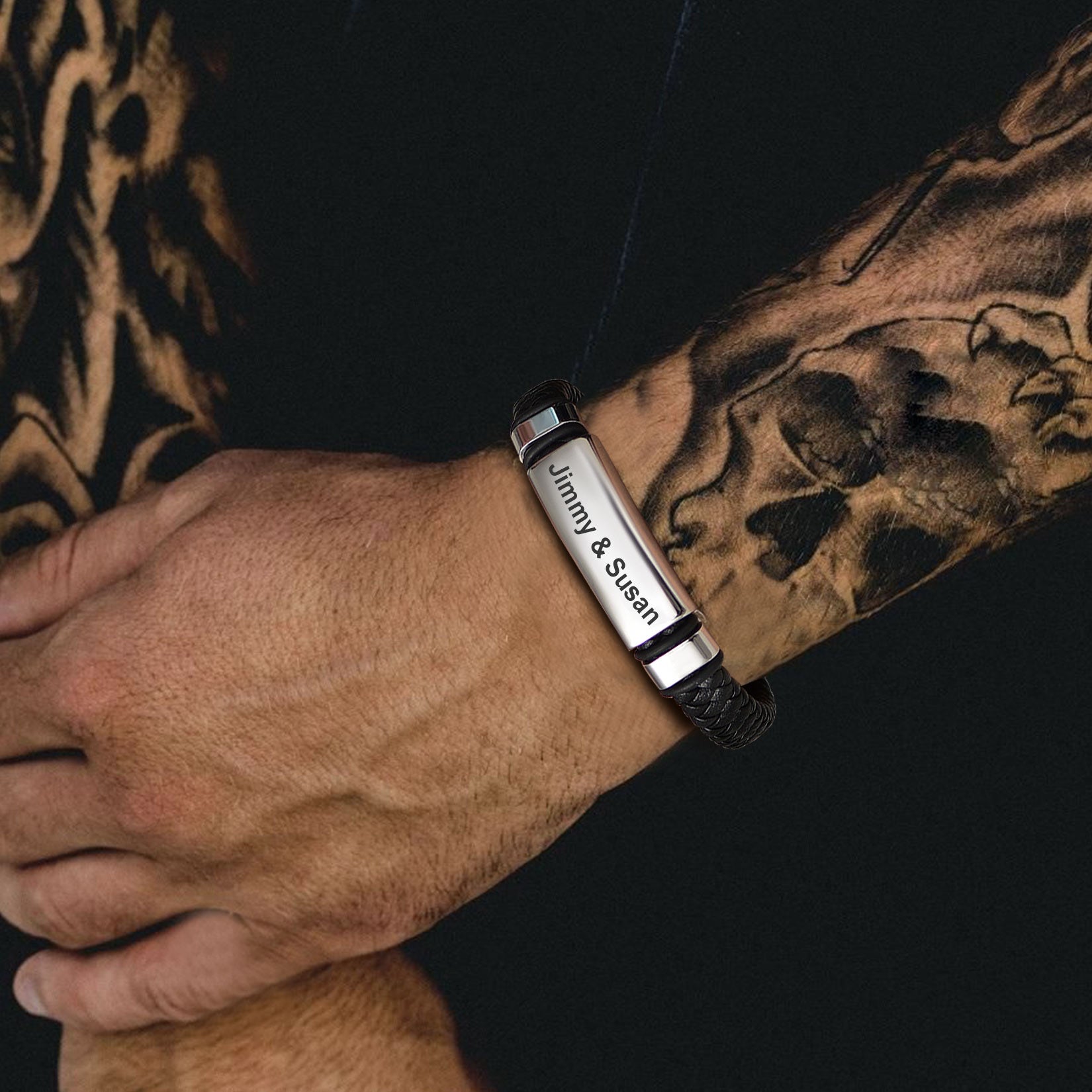 Man wearing custom engraved leather bracelet, Jimmy & Susan