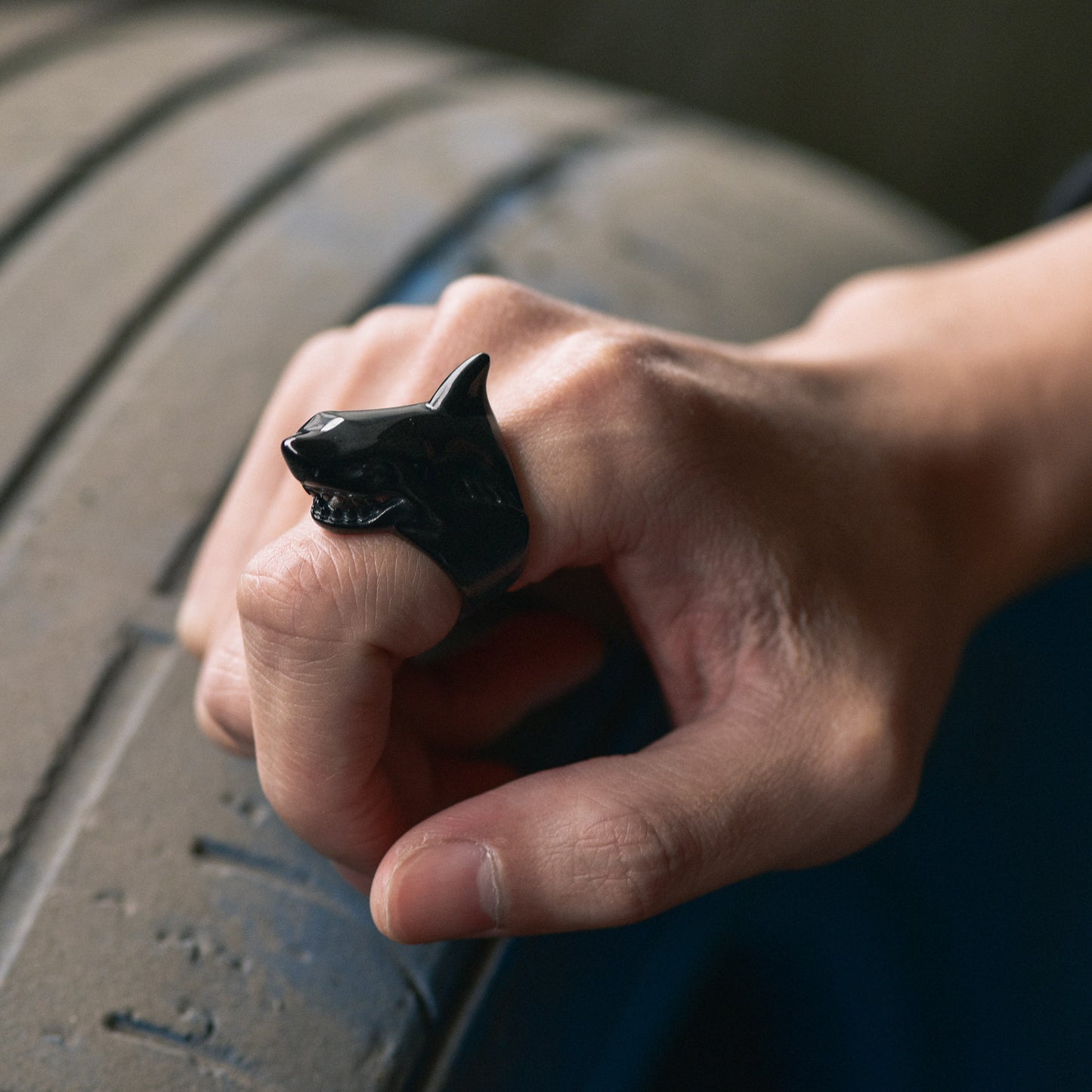 Man wearing black shark signet ring