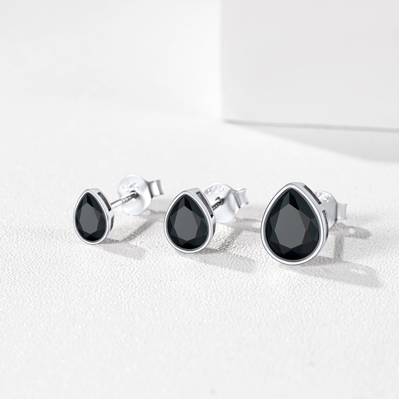 Black cubic zirconia pear stud earrings in sterling silver