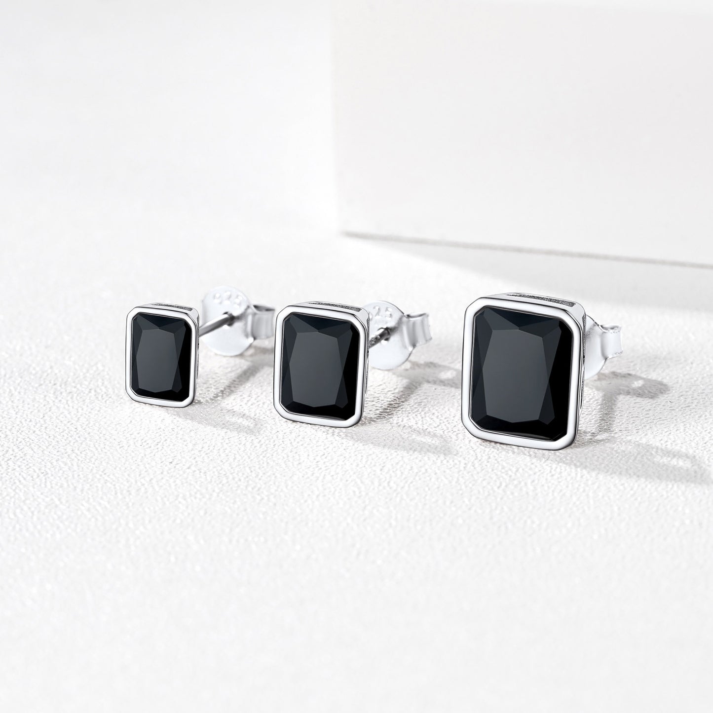 Sterling silver stud earrings with black CZ stones