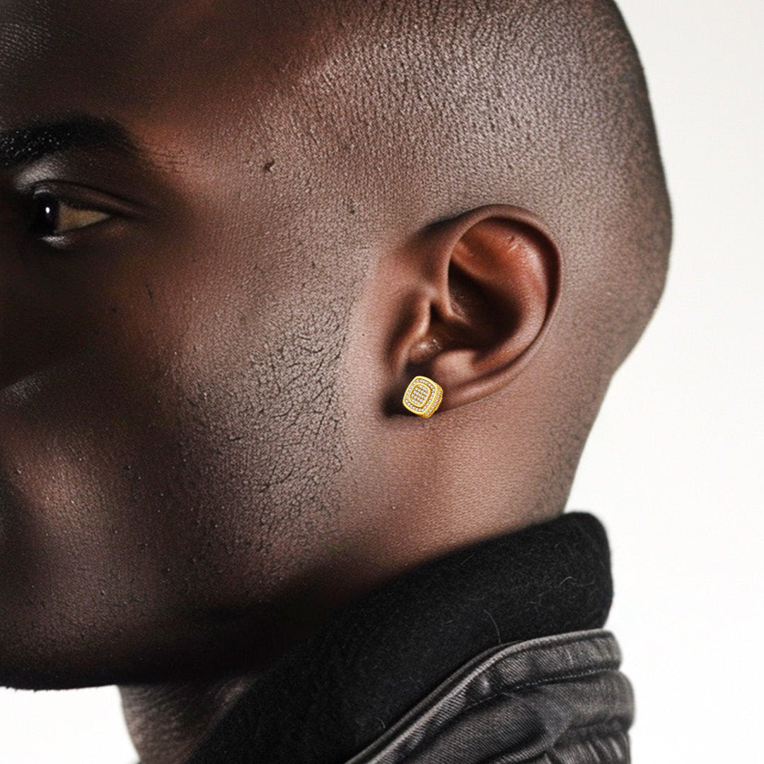 Man wearing gold cubic zirconia stud earrings