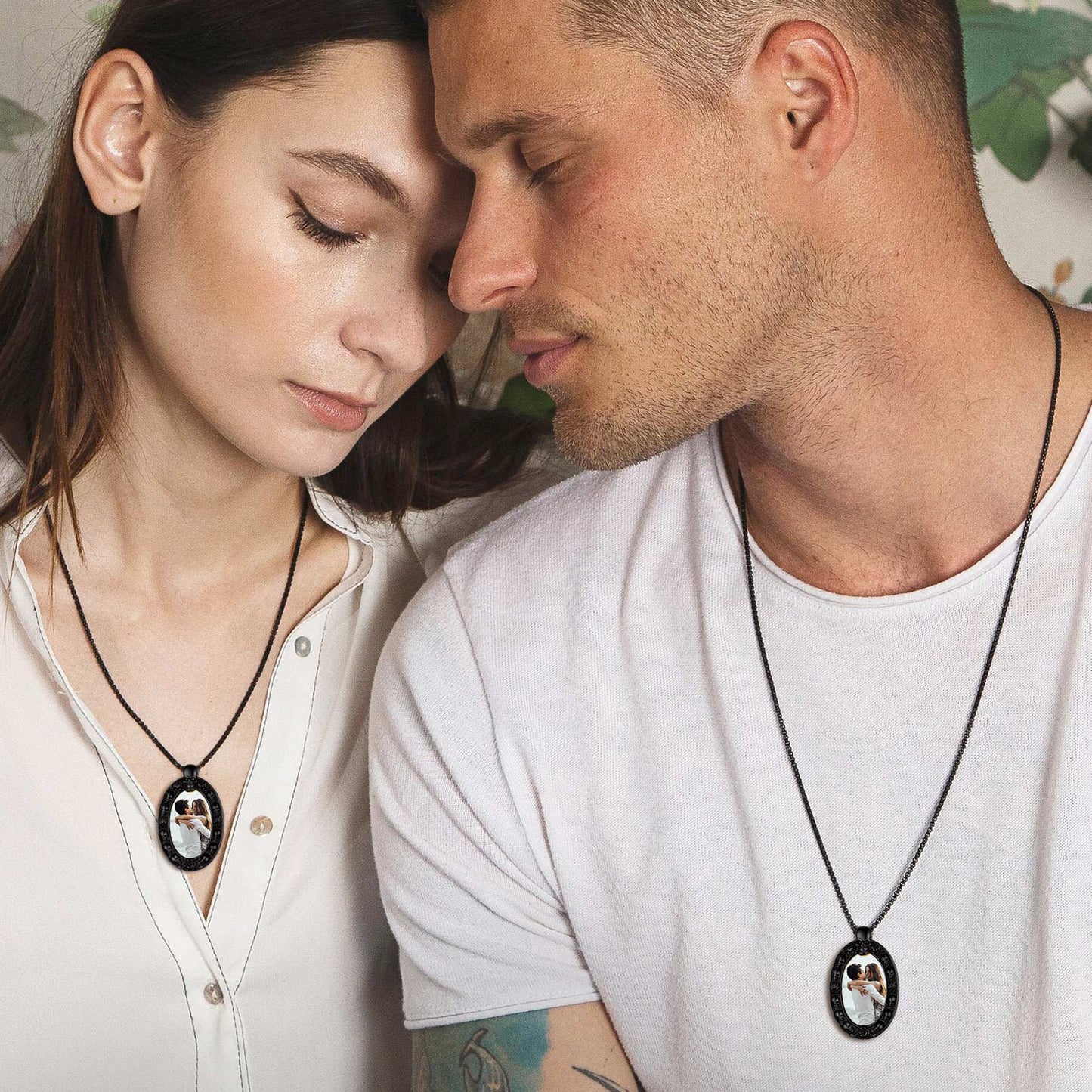 Couple wearing personalized photo pendant necklace