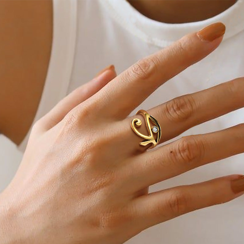 Golden Eye of Ra ring on a finger