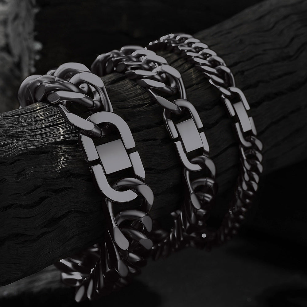 Close-up of thick Cuban link chain bracelets